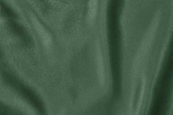 柔らかいドレープ生地の濃い緑色の背景 — ストック写真