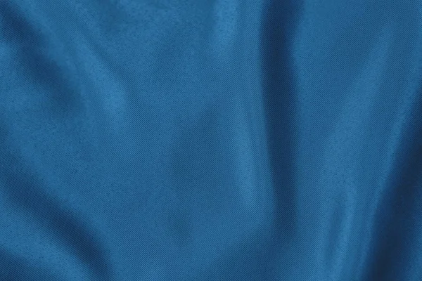 Dark blue colored Background of soft draped fabric — Stock Photo, Image