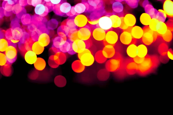 Färgglada cirklar bokeh festligt glitter mörk bakgrund — Stockfoto