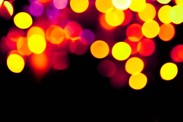 Cerchi colorati bokeh festivo glitter sfondo scuro — Foto Stock