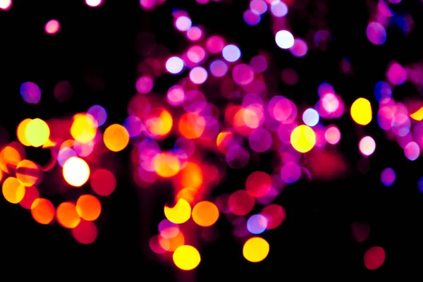 Kleurrijke cirkels bokeh feestelijke glitter donkere achtergrond — Stockfoto