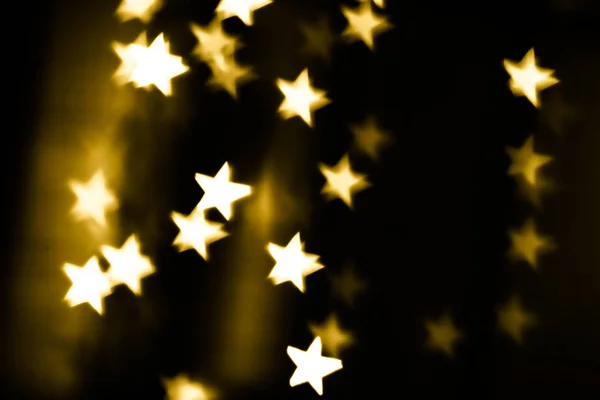 Golden stars bokeh background — Stock Photo, Image