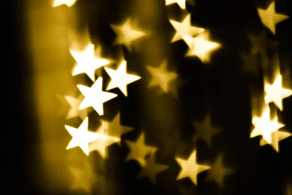 Золотые звезды боке — стоковое фото