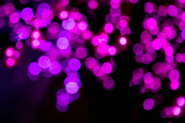 Círculos rosados brillantes bokeh festivo brillo fondo oscuro — Foto de Stock