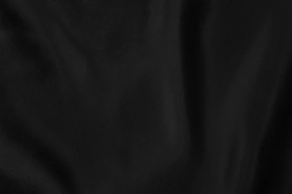 Schwarz gefärbter Hintergrund aus weich drapiertem Stoff — Stockfoto