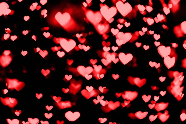 Vermelho e rosa coração bokeh festivo brilho fundo — Fotografia de Stock
