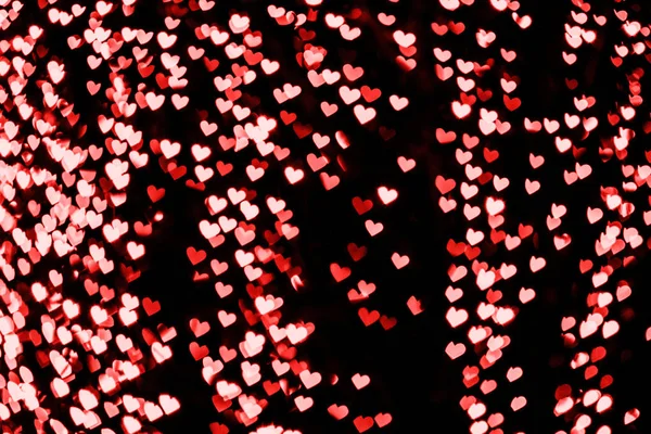 Rood en roze hart bokeh feestelijke glitter achtergrond — Stockfoto