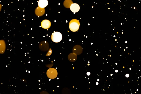 Círculos dorados festivo brillo bokeh fondo oscuro — Foto de Stock