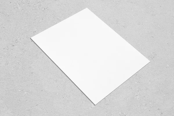 Empty white rectangle poster mockup lying diagonally on neutral grey concrete background — 스톡 사진