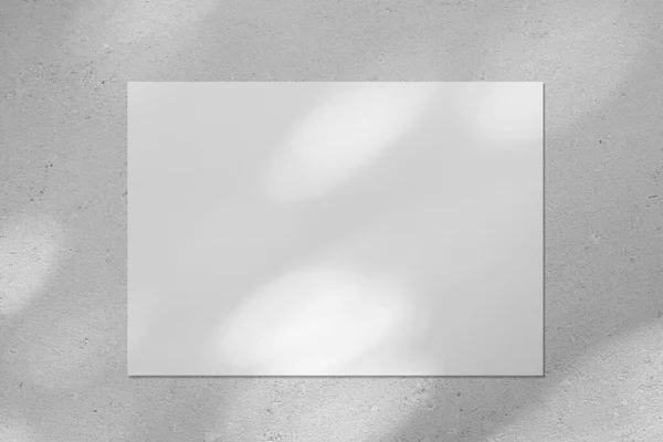 Empty white horizontal rectangle poster mockup with diagonal window shadow on the wall — Stock Photo, Image