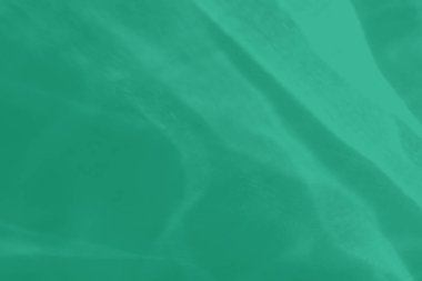 Işık ve gölgeli yakıcı efektli naneli, soyut arkaplan. Işık camdan geçer. 2020 yıllık renk eğilimi