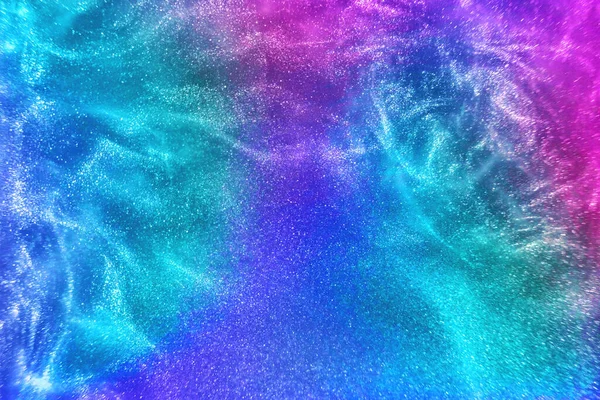Abstract Neon Rainbow Colored Glitter Particles Flow Shallow Depth Field — Fotografia de Stock