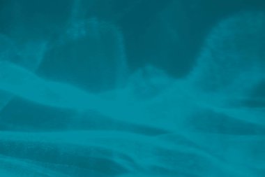 Moda mavisi soyut arka plan, ışık ve gölge yakıcı etkisi var. Işık bir bardaktan geçer, su dokusu üstüste gelir.