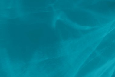 Moda mavisi soyut arka plan, ışık ve gölge yakıcı etkisi var. Işık bir bardaktan geçer, su dokusu üstüste gelir.