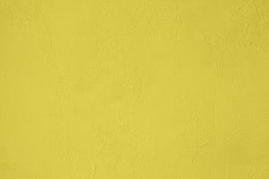 Doymuş sarı renkli düşük kontrastlı Beton pürüzlü ve düzensiz bir arka plan. 2020, 2021 Renk Eğilimi.