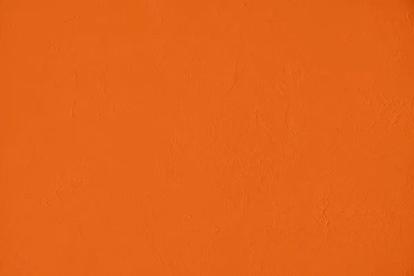 彩度の高いオレンジ色の低コントラスト粗さと凹凸のある具体的なテクスチャの背景 2020年 2021年カラートレンド — ストック写真
