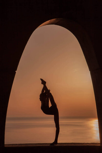 silhouette of gymnast