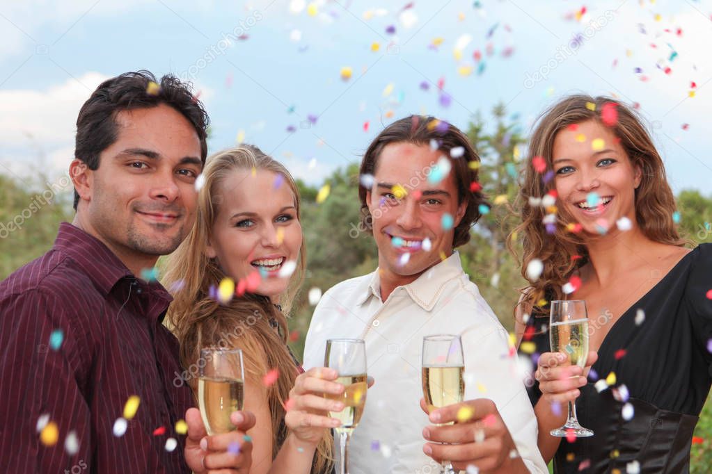 group champagne toast at party or wedding