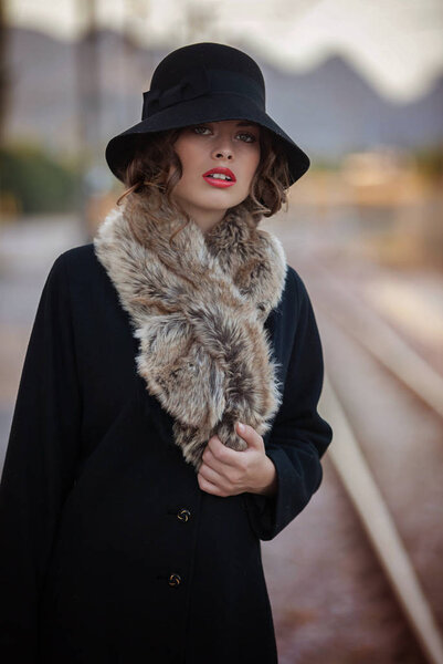 woman waiting at railway station