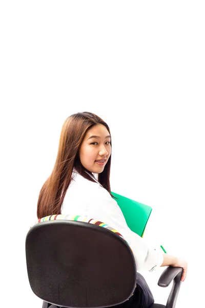 Pretty Asian young woman sitting on office chair — Stock Photo, Image