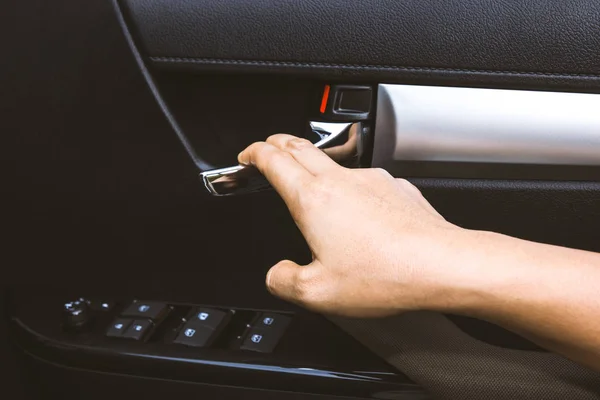 Close up hand opens the inner door handle — Stock Photo, Image