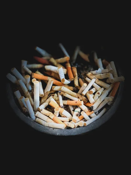 Ashtray in the dark scene tobacco smoking backgrounds