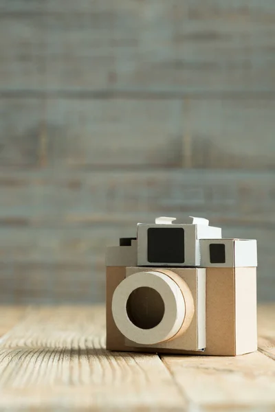 Camera paper on the wood background Stock Image