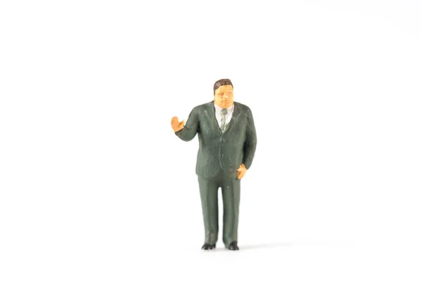 Miniatuur zakenman op witte achtergrond met een ruimte voor tekst — Stockfoto