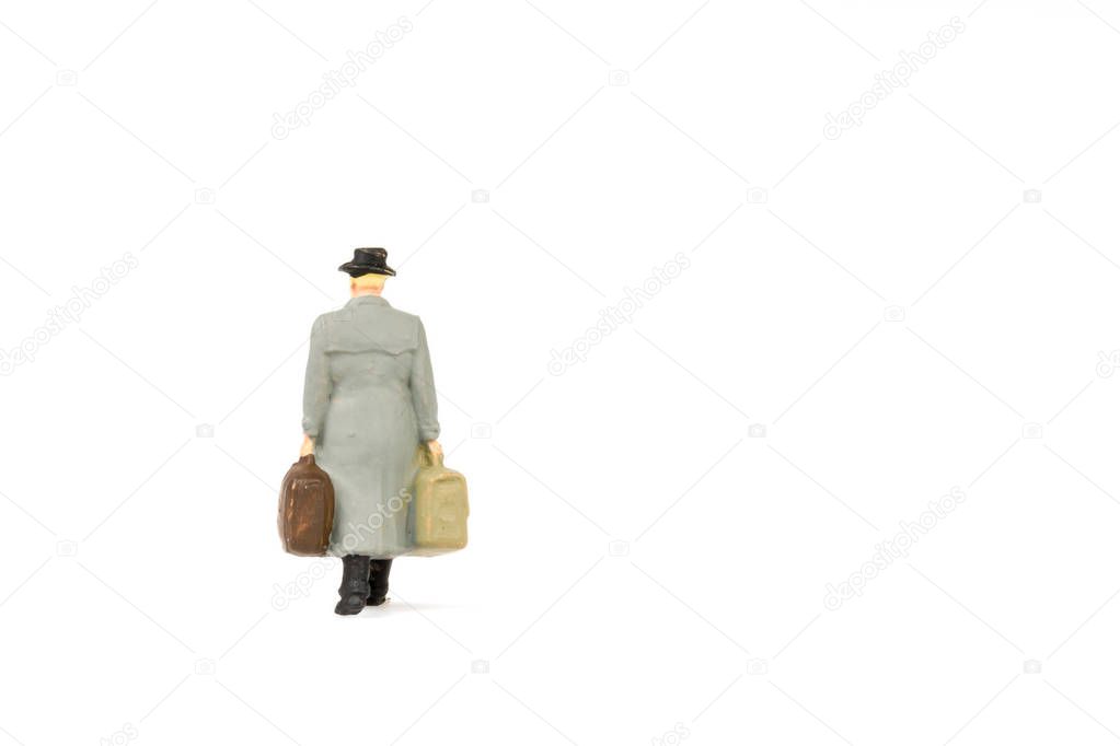 Miniature people business traveler on background with space for 