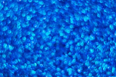 Mavi parlak arka plan. Bokeh. Parıltı. Pullu taraf. Klasik mavilik. Sihir