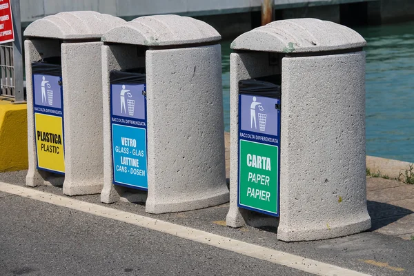 Bins for different types of garbage on pier of Piombino — Stock Photo, Image