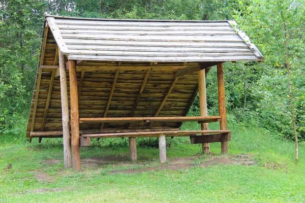 Old style wooden canopy with bench in forest park — Stock Photo, Image