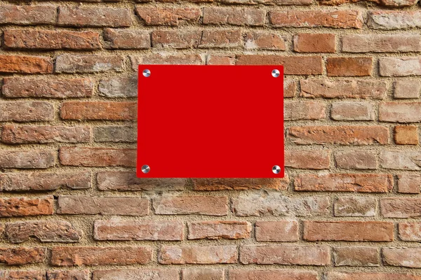 Empty information sign on old brick wall. Red color — Stock Photo, Image