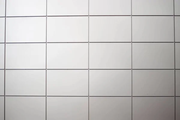 Wall panels of gray tile.