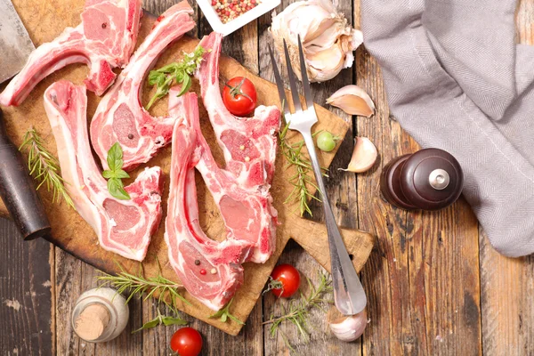 Raw meat with spices — Stock Photo, Image