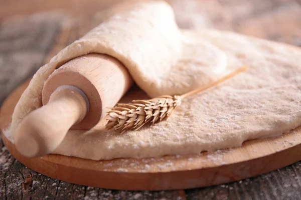 Raw dough on table — Stock Photo, Image