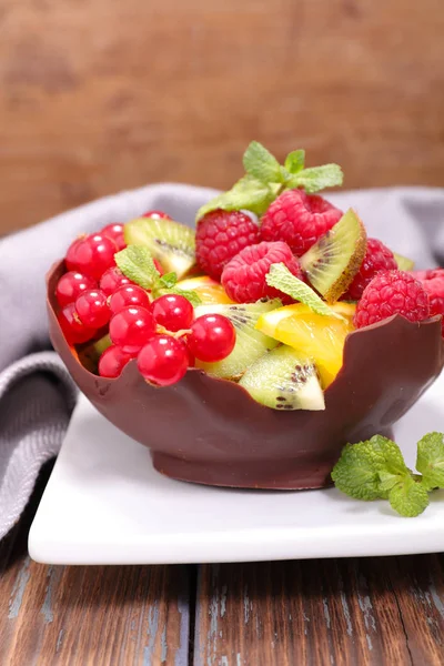 Fruits salad in chocolate bowl — Stock Photo, Image