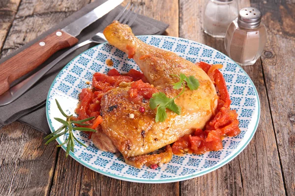 Chicken leg with tomato — Stock Photo, Image
