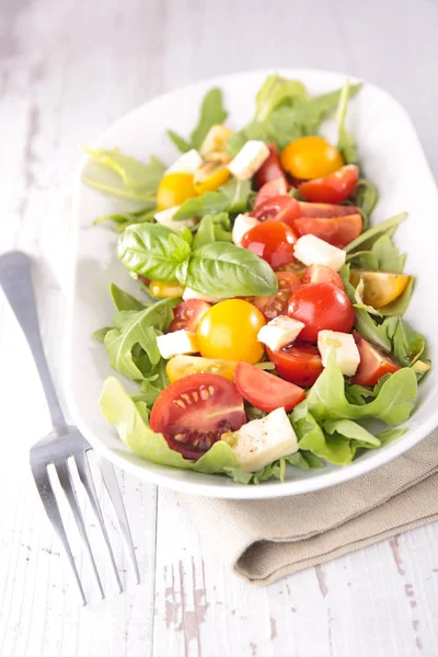 Tomato salad in  white plate — Stock Photo, Image