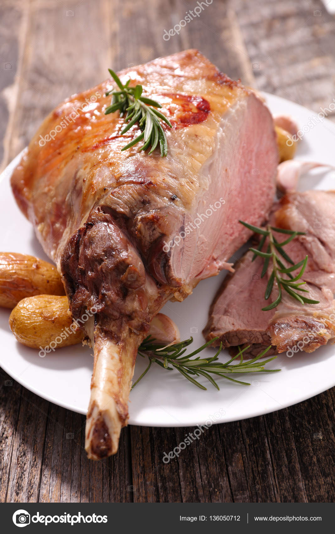 Roasted lamb leg — Stock Photo © studioM #136050712