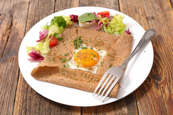 Buckwheat crepe with egg and cheese — Stock Photo, Image