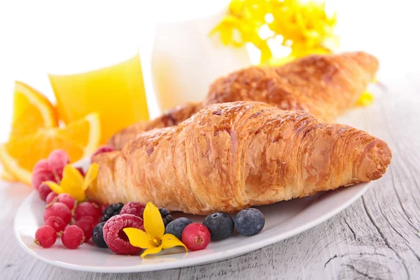 Croissant and orange juice — Stock Photo, Image