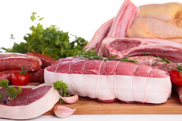 Raw meat on wooden table — Stock Photo, Image