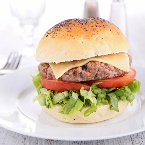 Hamburger on white plate — Stock Photo, Image