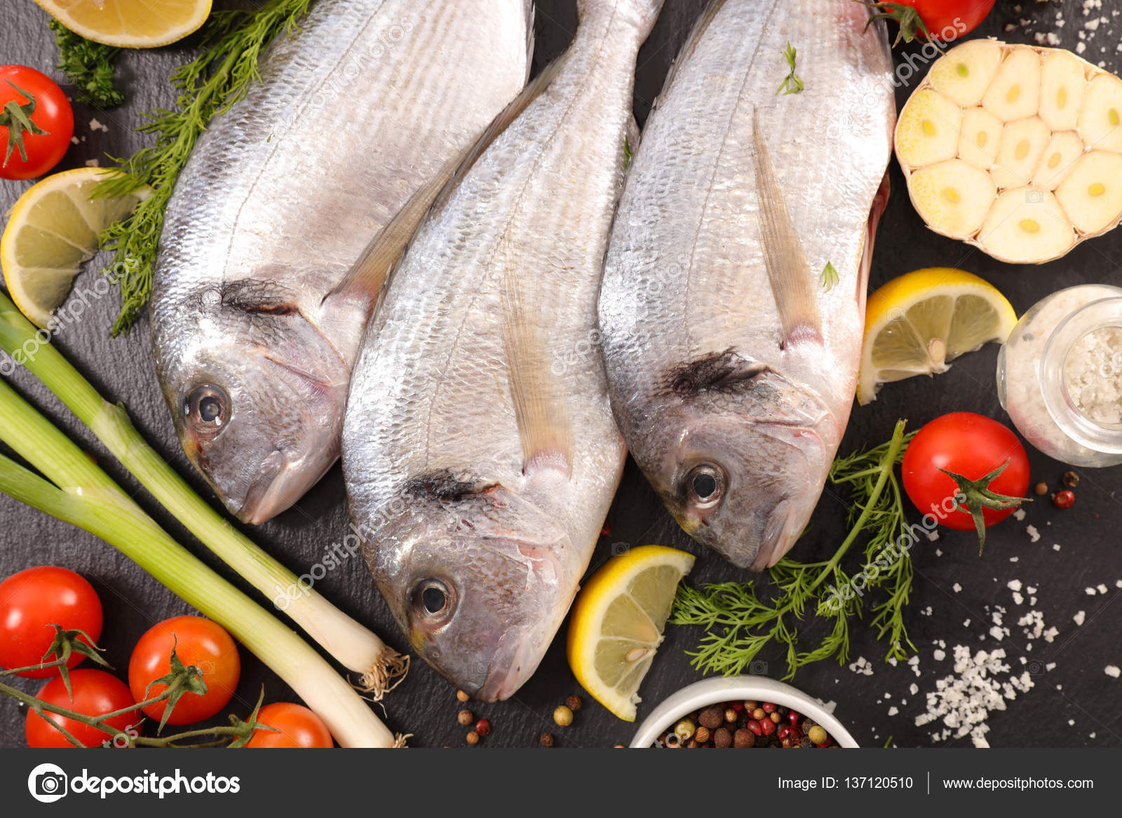 Raw fish with ingredients Stock Photo by ©studioM 137120510