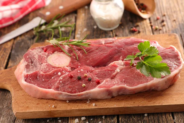Raw meat on board Stock Picture