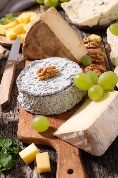 Assorted cheese and snacks — Stock Photo, Image
