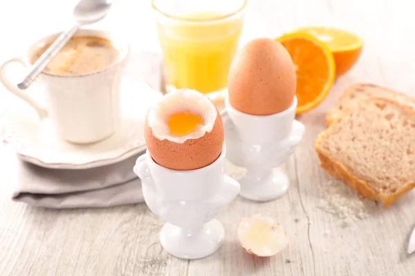 Boiled eggs and coffee on table — Stock Photo, Image