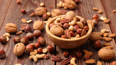 Assorted nuts on table clipart