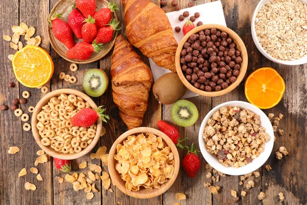 Breakfast with different flakes and fruits — Stock Photo, Image